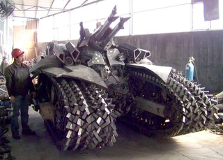 Illustration for article titled Life-sized Transformers statues are scrap metal in disguise